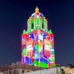 colorful projections on City Hall in Unwrap the Magic Show